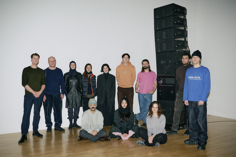 group photo, standing, from left to right: Johannes Michael Stanislaus, Florian Hecker, Camilla Metelka, Léa Manoussakis di-Bona,
Caroline Kretschmer, Bradley Leonard, Vasilii Vikhliaev, focus baby, Bruno Younes Haas
seated, from left to right: Sofian Biazzi, Jahy Hwang, Maria Margolina, Sound_and_Experiment_X_Lenbachhaus_Kunstbau, Lenbachhaus Munich, 2025. Photo: Lukas Schramm, Lenbachhaus
